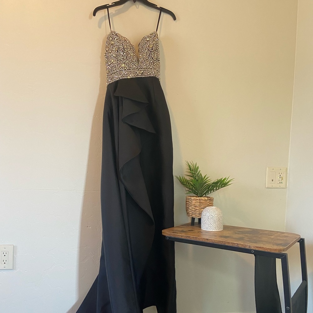 Black pencil gown w/ side train. Empire cut beaded bodice in perfect condition!